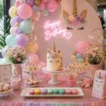 Pastel unicorn-themed birthday dessert table featuring handcrafted Box of Nom macarons, unicorn cake, cupcakes, balloons and elegant party decorations.