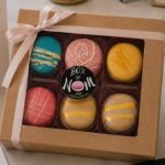 Elegant six-piece Box of Nom French macaron gift box featuring handcrafted Birthday Cake, Earl Grey, Lemon, Berry and Cappuccino macarons in premium gift packaging.